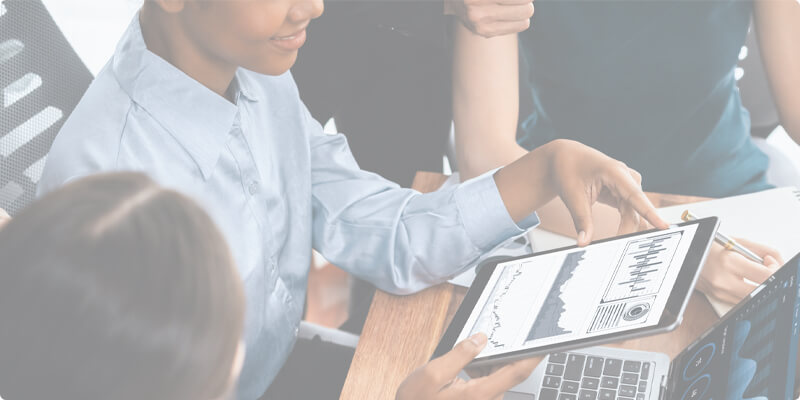 Coworker displaying charts on a tablet computer.