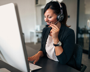 Team member speaking via a headset to an accountholder.