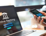 A person accessing their credit card information while logging into online banking.