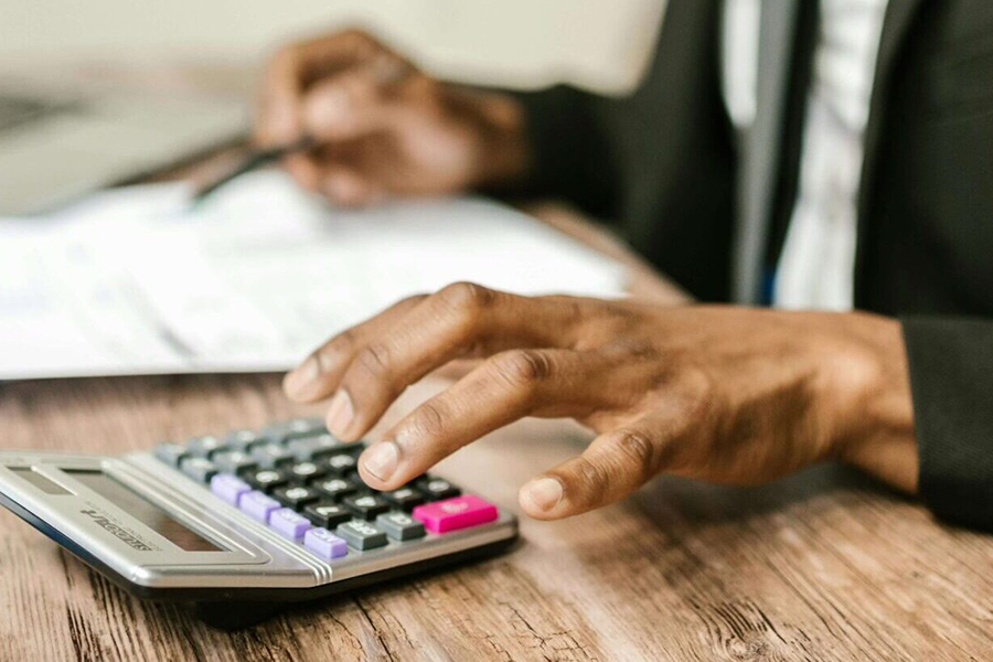 hand and calculator