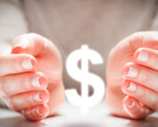 Hands cupped around a dollar sign.